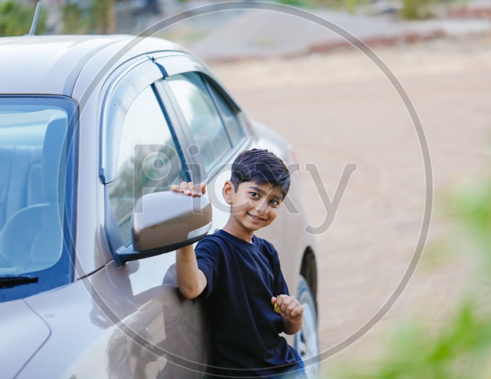 Indian Kid r child Posing At a Car