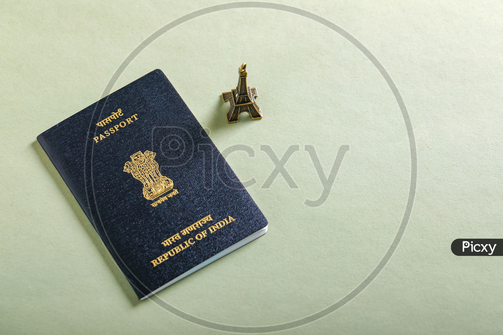 Travel Concept   Indian Passport With Eiffel  Tower On an isolated Background