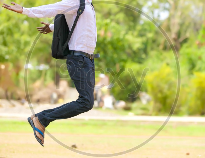 Confident Indian Student or Young Man  Smiling and Jumping High