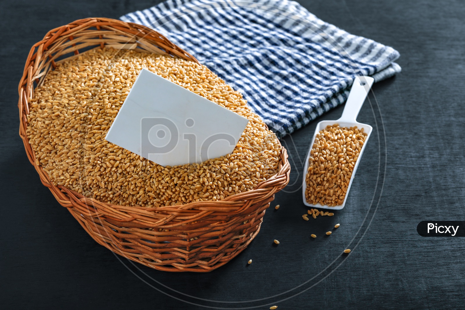 Wheat Grains In an Wooden Weaved Basket On an Isolated  Background