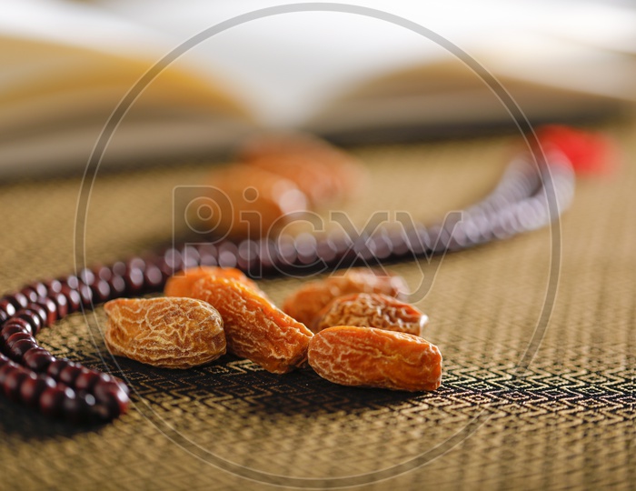 Dry Date Fruits  With Islamic Prayer beads on an Artistic Background   Backgrounds For Ramzan or Ramadan