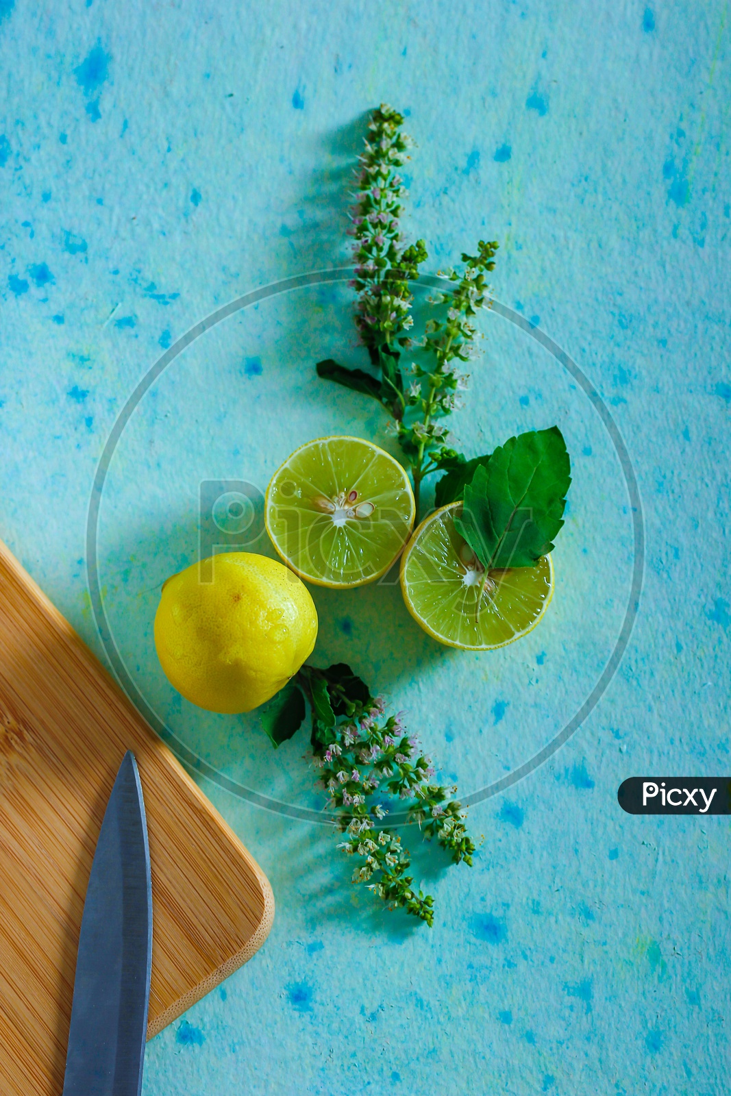 Lemons And Tulsi Leafs On a Wooden  Table For Black Tea