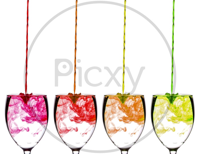 Colours Or Colouring Diffuse  inside Water  in a Wine Glass On an Isolated White Background