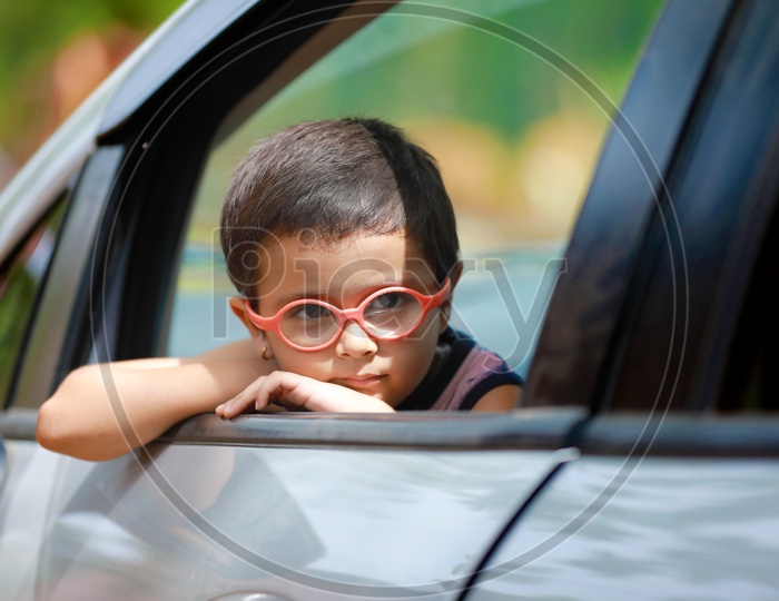 Indian Cute Kid or Child In a Car