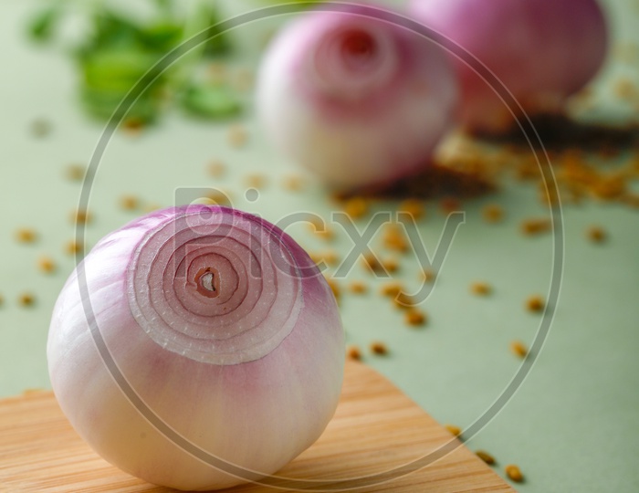 Red Onions Peeled  And Spices Sprinkled On an  Isolated Background