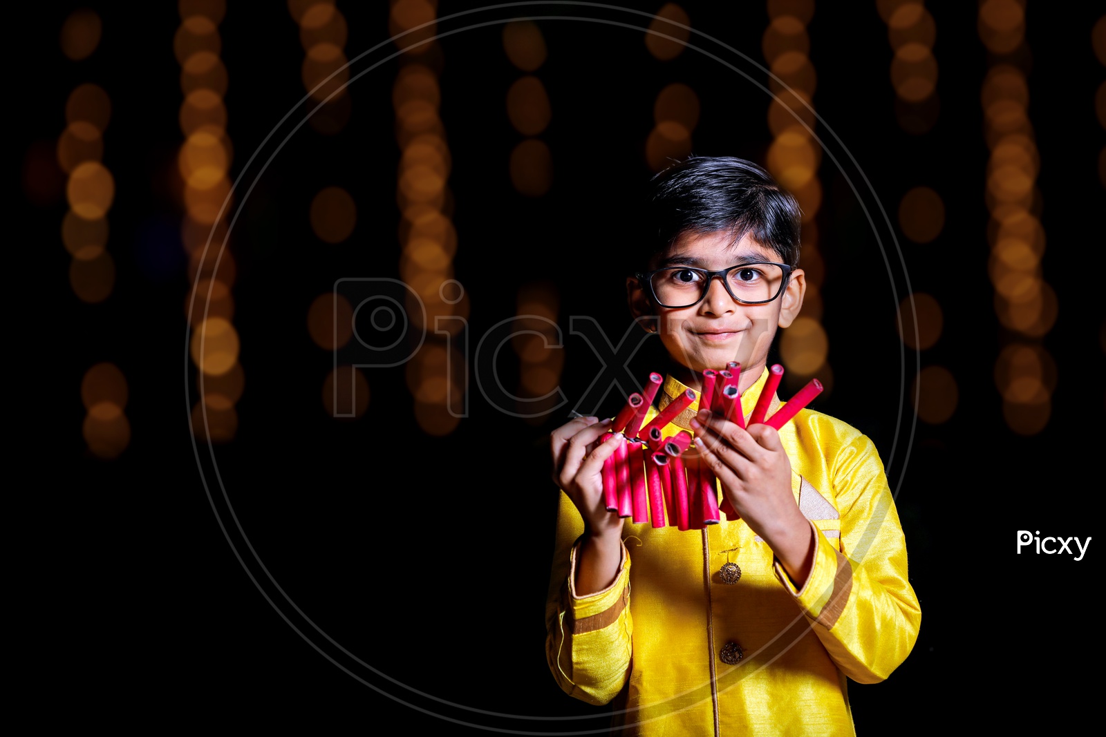 Indian Young Boy Or Kid In Traditional Wear Celebrating Diwali Festival