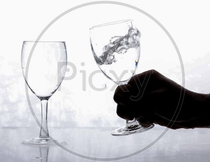 Wine Glasses Filled With Water On an Isolated White Background