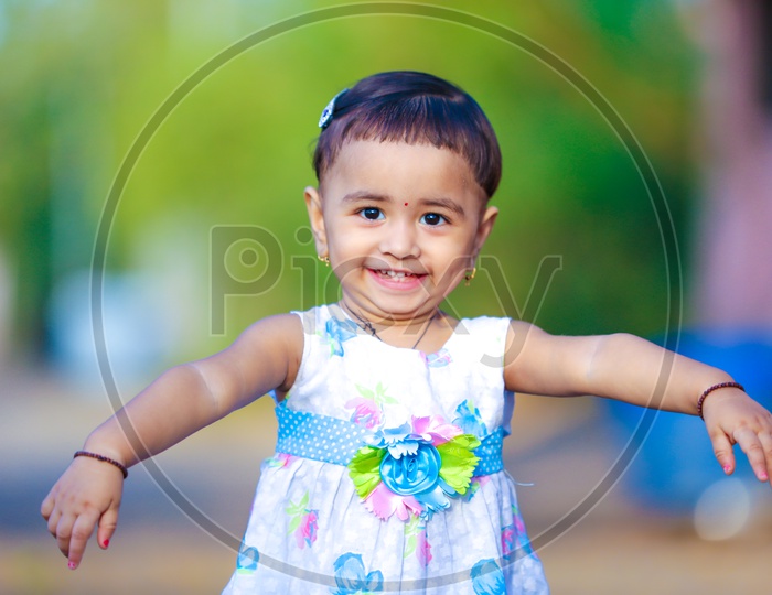 Cute Little Girl Child Playing in Outdoor