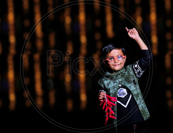 Indian Boy Or Kid Or Child  Celebrating Diwali Festival With Crackers
