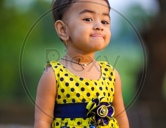Cute Little Girl Child Playing in Outdoor