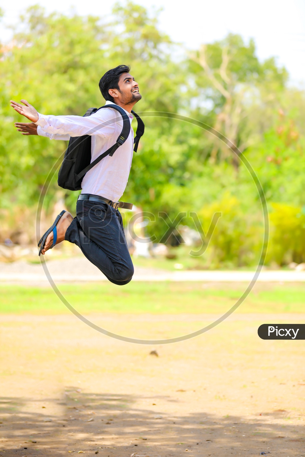 Indian College Student Jumping In Joy Or Success