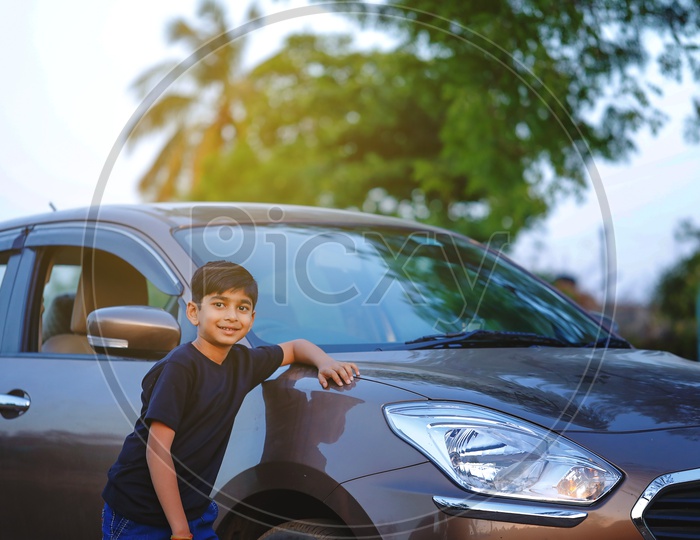 Indian Young Boy Or Kid Or Child  Posing At a Car