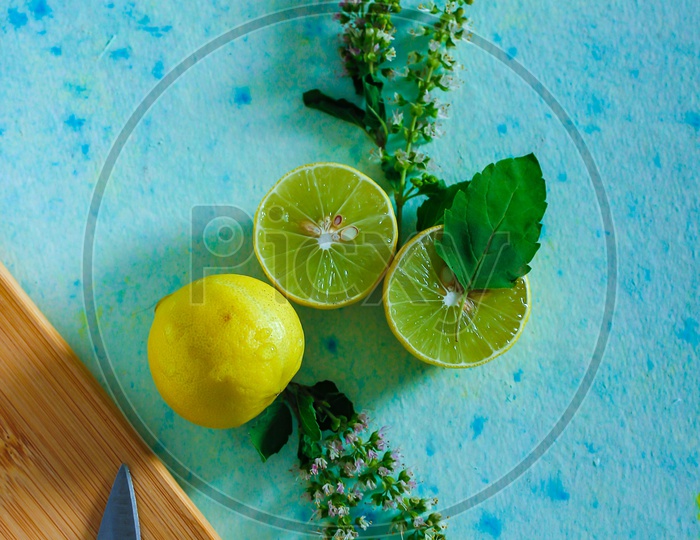 Lemons And Tulsi Leafs On a Wooden  Table For Black Tea