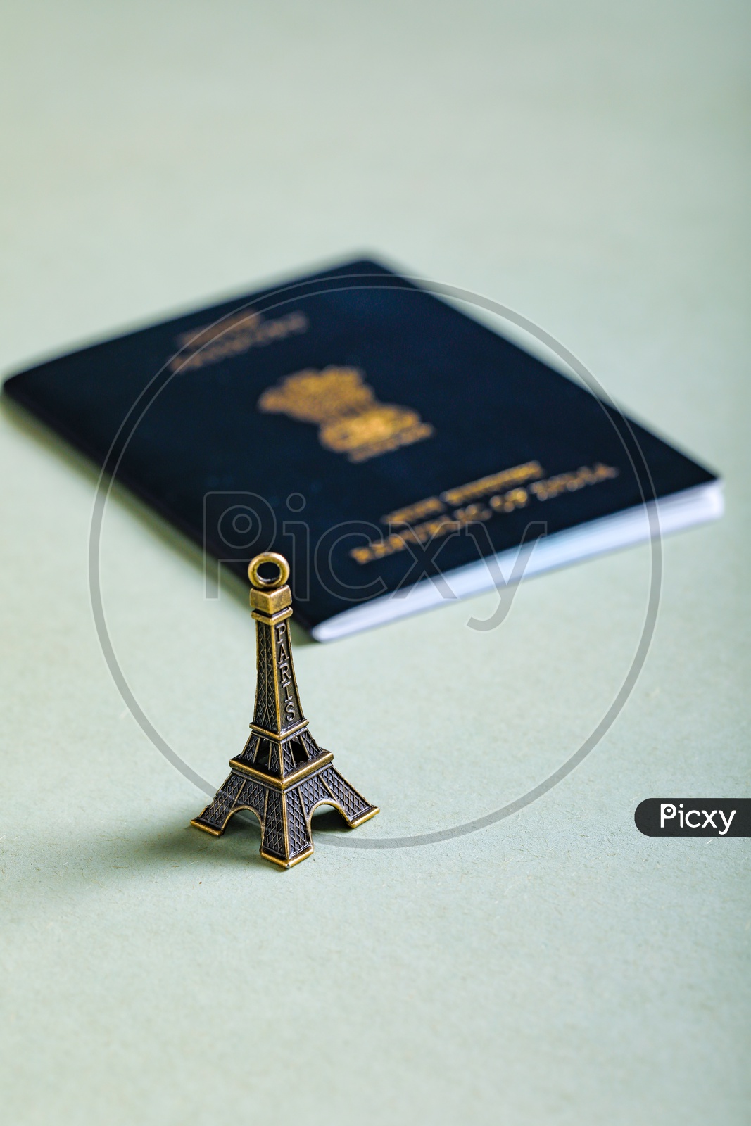Travel Concept  Indian Passport And Eiffel Tower Miniature