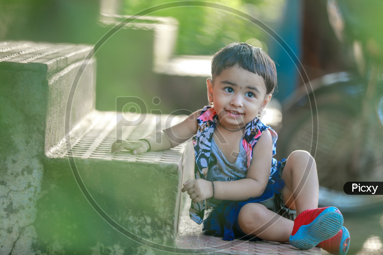 Cute Indian Girl Child Or Baby Girl Playing in a Park