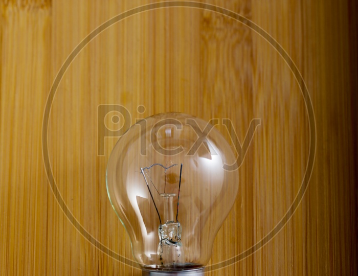 Bulb Or Electric Bulb On Wooden Background
