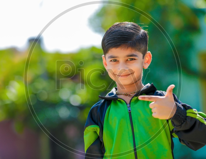 Indian Young Boy or Kid Or Child Posing Outdoor With Smile Face