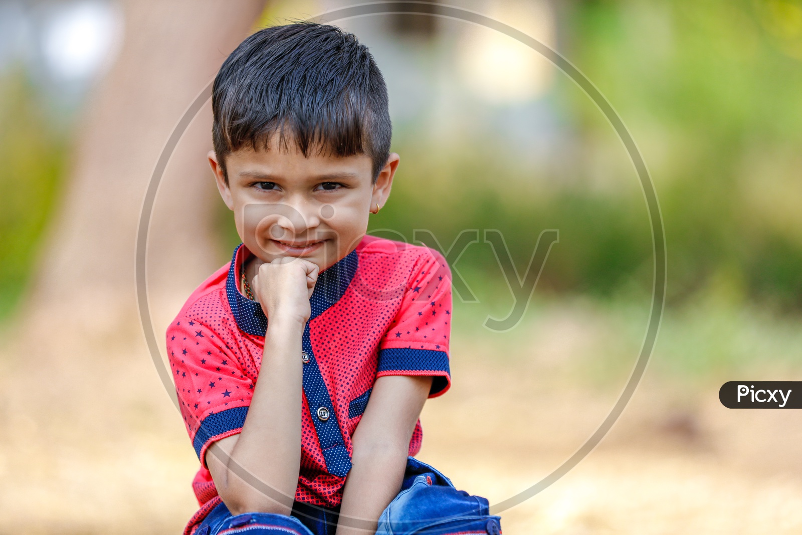 Image of Indian Boy With Multiple Expressions On Outdoor Background