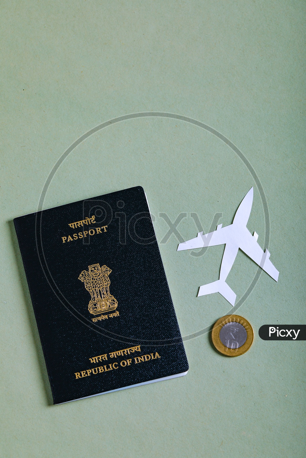 Travel Concept  Indian Passport And Paper Airplane and Indian Coin