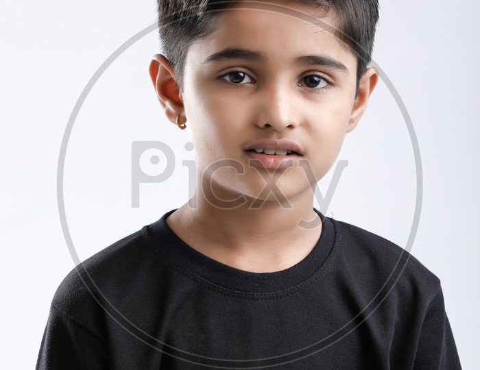 Indian or Asian Boy or Kid O r Child  With Multiple Expressions and Posing over an Isolated White Background