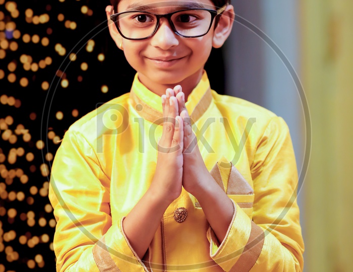 Young Boy Kid Child  in Traditional Wear With Namaste Gesture or Welcoming gesture on Festival Day