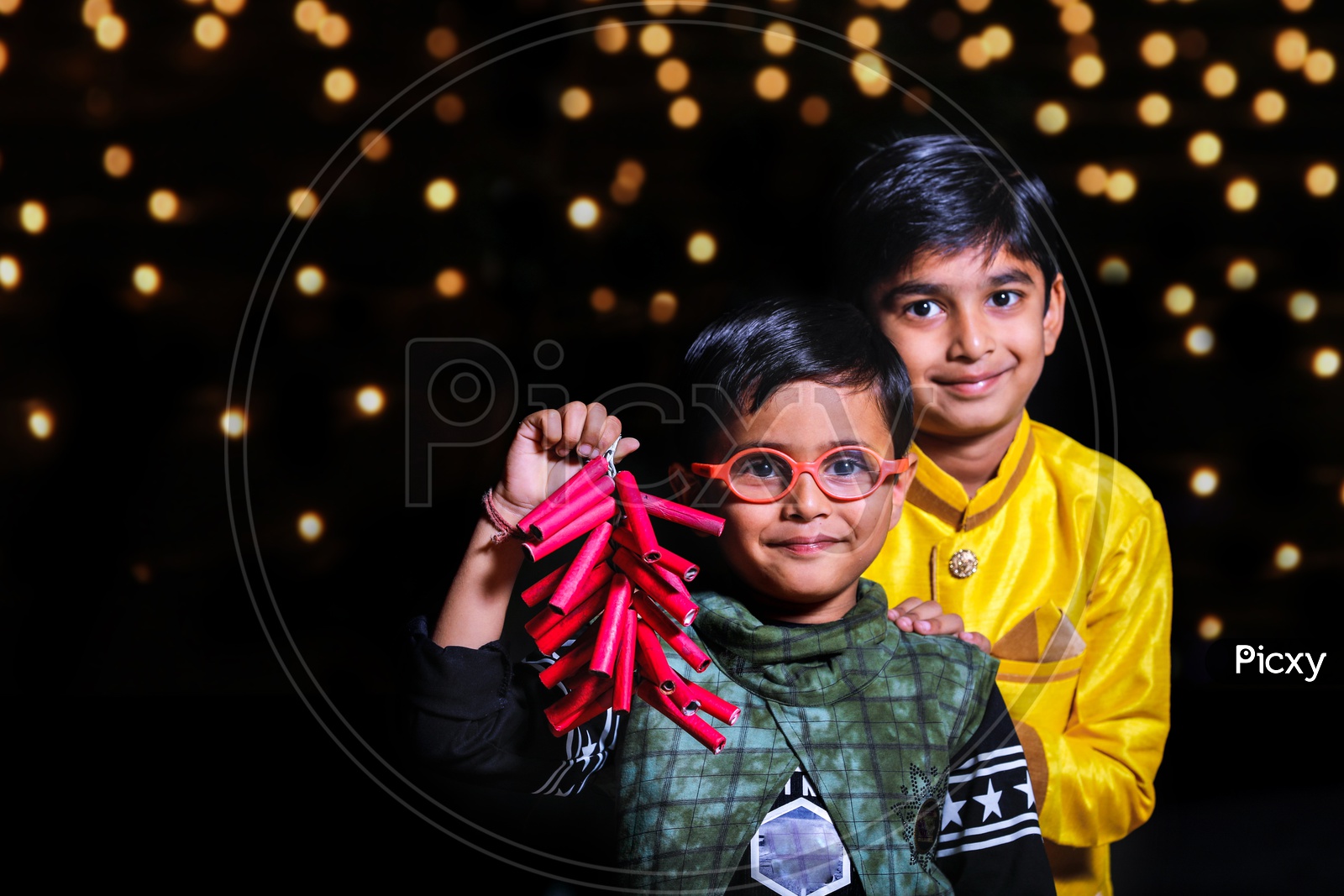 Two Cute Indian Kids Or Boys  or Siblings  Wearing Traditional Dress  Celebrating Diwali Together