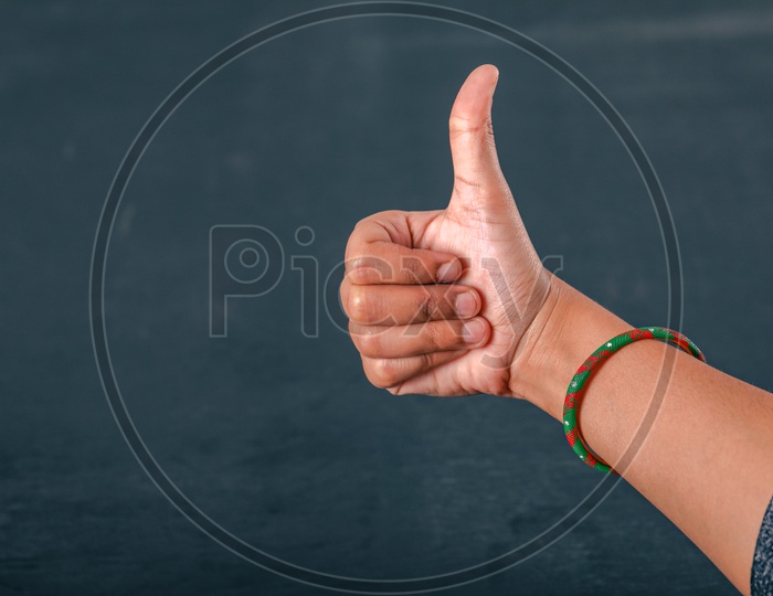 Woman Hand Showing Thump up Gesture Closeup