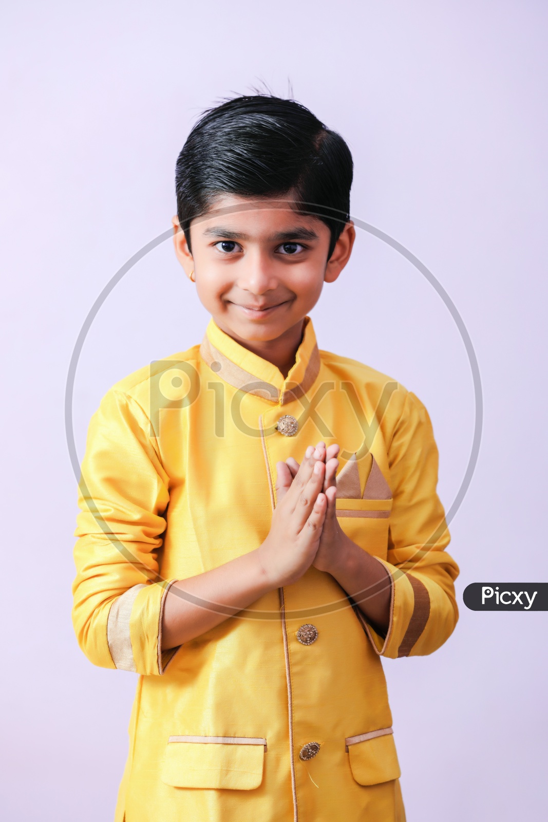 Young Boy Kid Child  in Traditional Wear With Namste Gestures And Posing