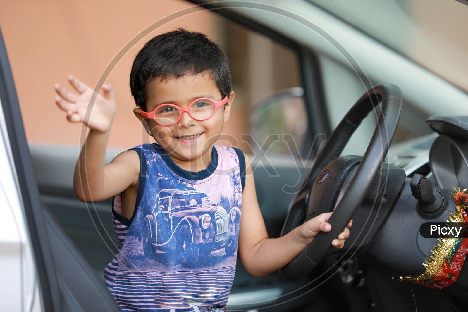 Indian Cute Kid or Child In a Car