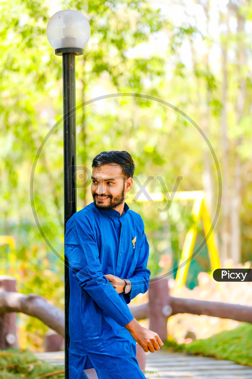 Indian stylish man in yellow traditional clothes with white scarf posed  outdoor Stock Photo - Alamy