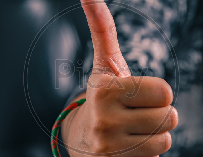 Woman Hand Showing Thump up Gesture Closeup