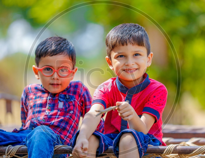 Two Cute Indian Kids Or Boys  or Siblings  or Friends  On Outdoor Background