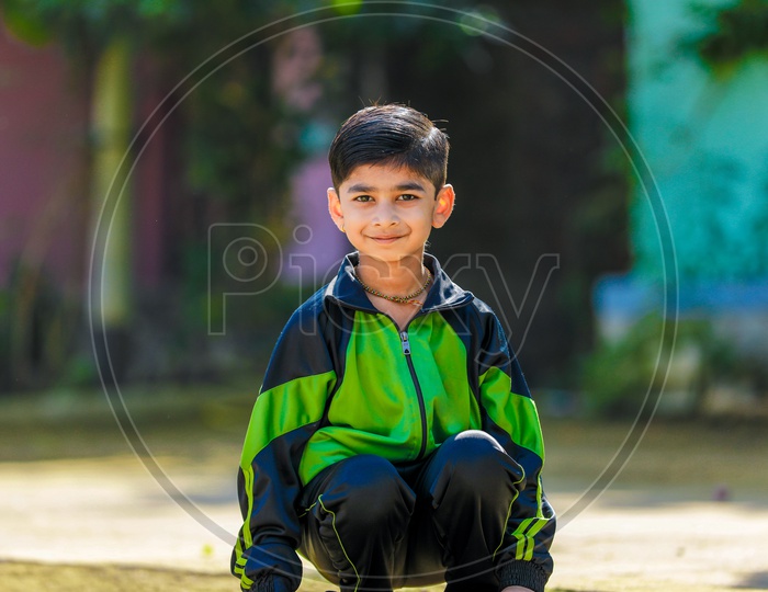 Indian Young Boy or Kid Or Child Playing  Outdoor With Smile Face