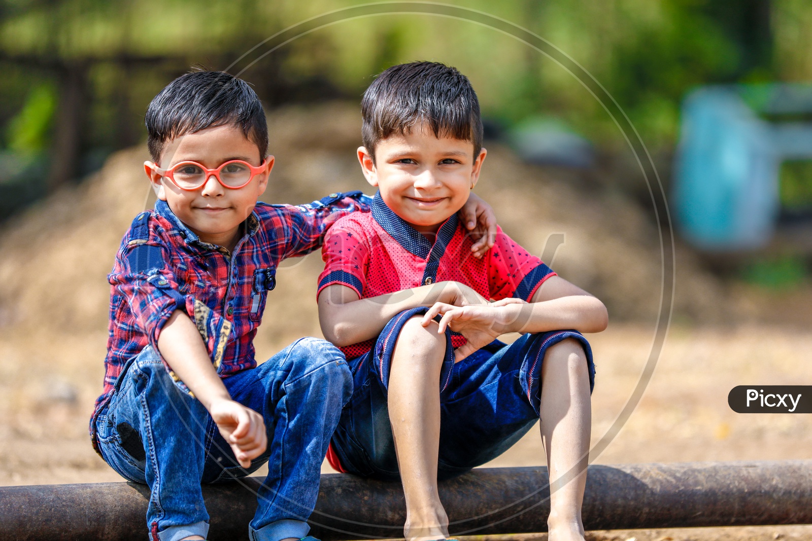 Two Cute Indian Kids Or Boys  or Siblings  or Friends Smiling On Outdoor Background