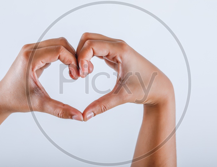 Human hand Showing Heart Shape on an isolated White Background