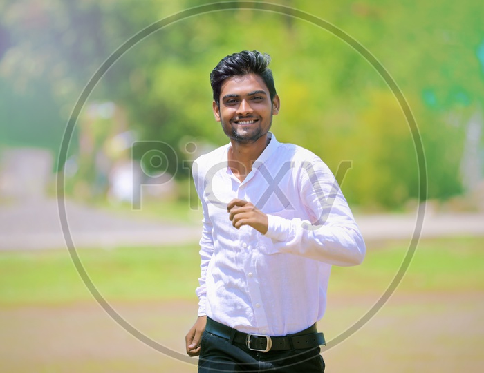 Confident Indian Student or Young Man  Smiling  And Running
