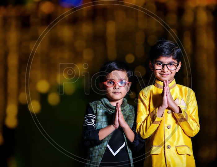 Two Cute Indian Kids Or Boys  or Siblings  Wearing Traditional Dress  Celebrating Diwali Together
