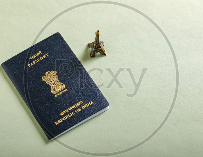 Travel Concept   Indian Passport With Eiffel  Tower On an isolated Background