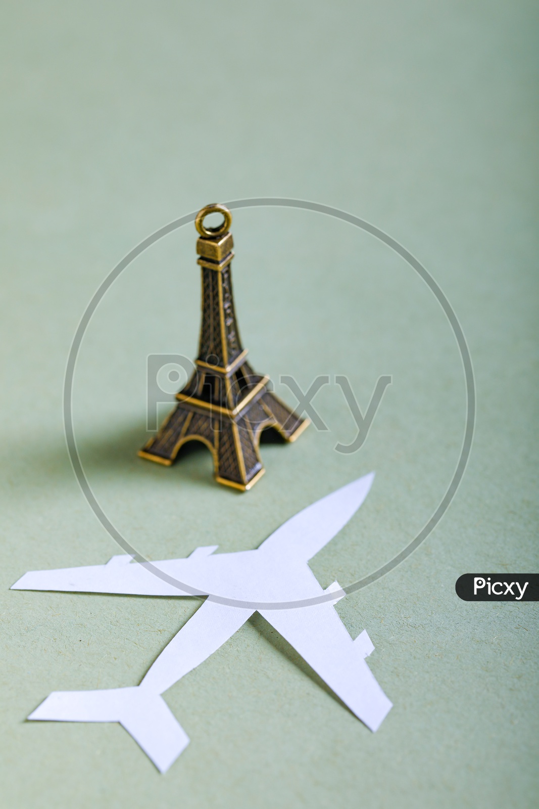 Travel Concept   Paper Airplane and Eiffel Tower Miniature