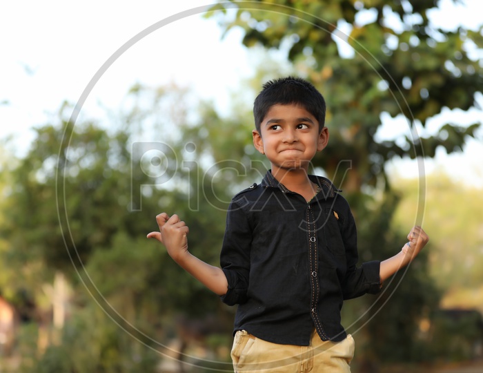 Indian Young  Boy Or Child Or Kid  With Multiple Expression and Posing Outdoor