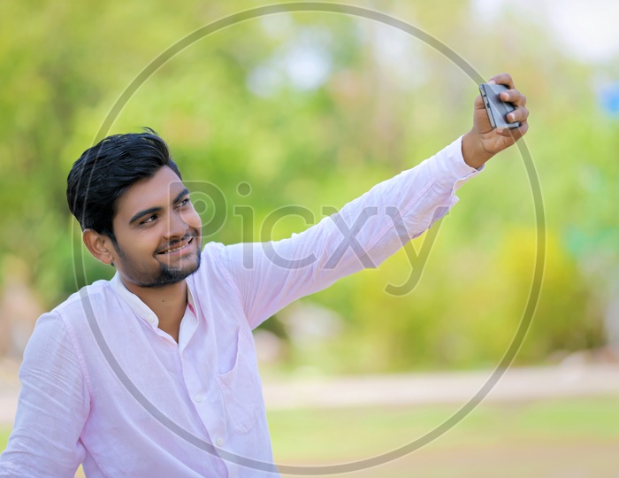 Indian College Student  Taking Selfie With Smartphone