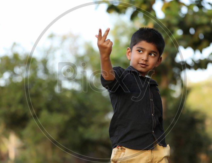 Indian Young  Boy Or Child Or Kid  With Multiple Expression and Posing Outdoor