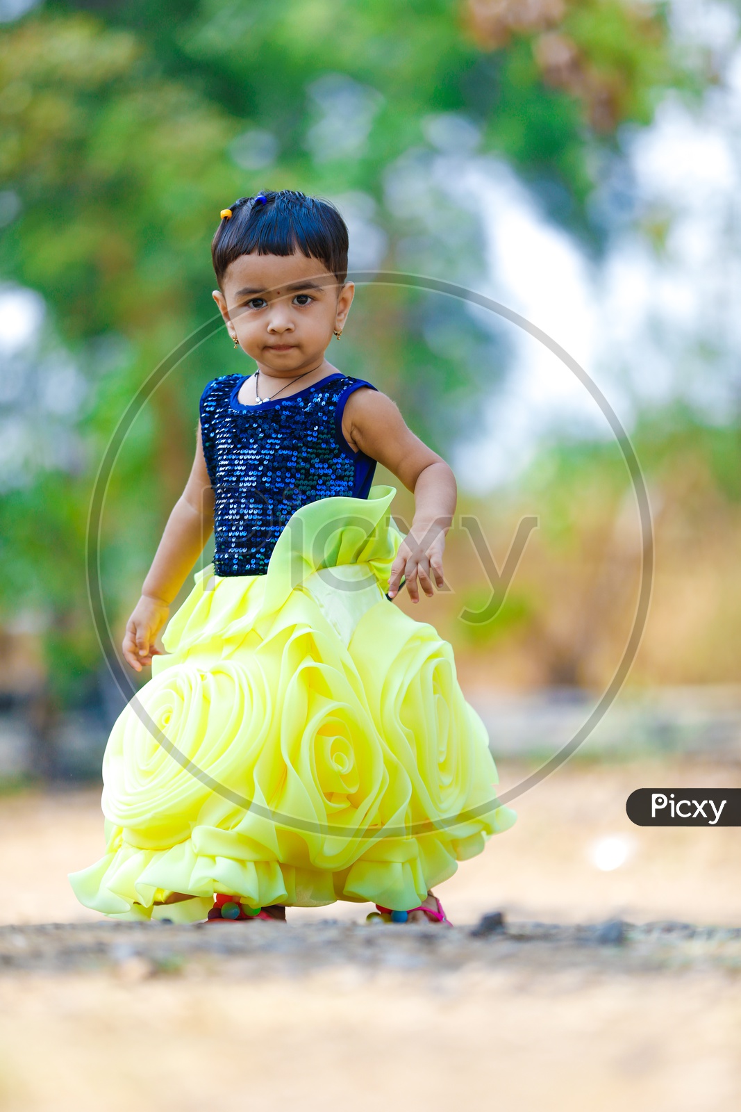 Cute Indian Girl Child or Baby Girl Playing With Multiple Expressions in Outdoor