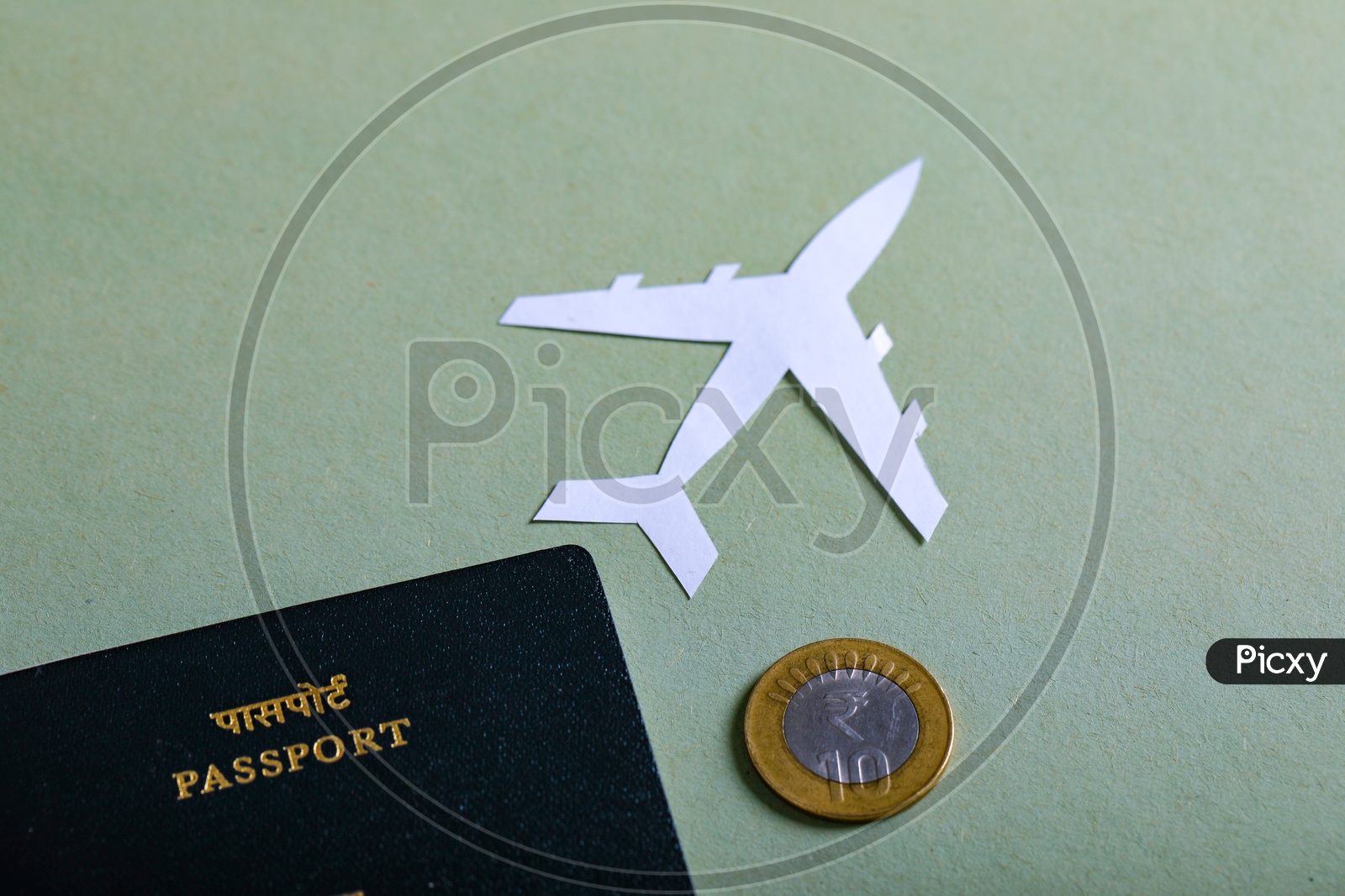 Travel Concept  Indian Passport And Paper Airplane Indian Coin on an Isolated White Background