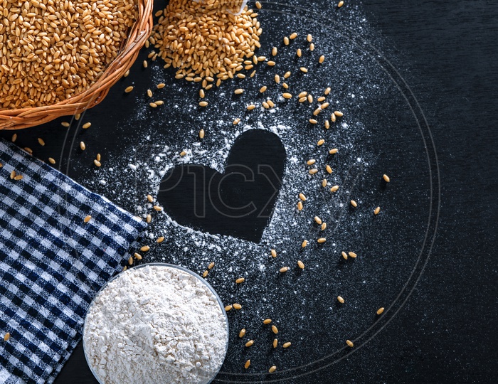 Indian Wheat Grains And Wheat Flour on an Isolated Background