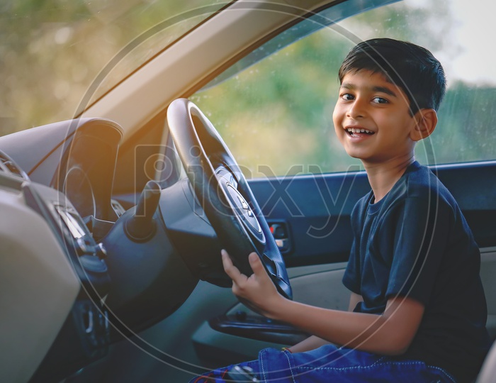 Young Indian Boy  or Kid Or Child in Car and Posing