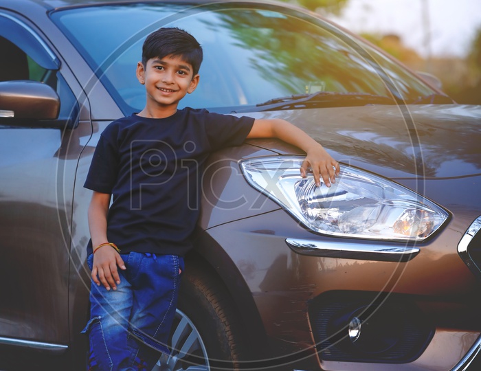 Indian Young Kid Or Child  Posing at a Car