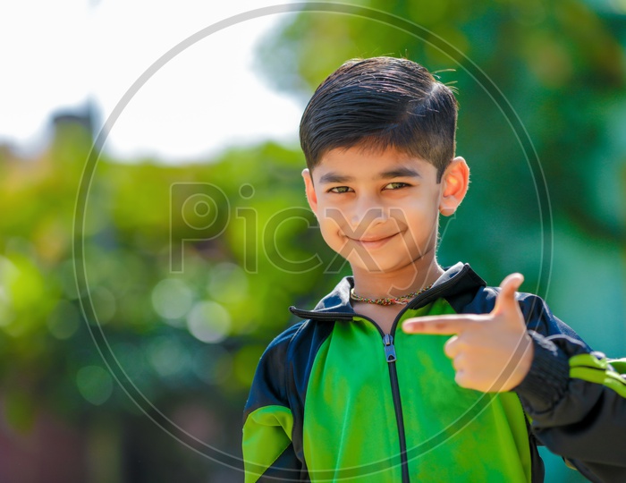 Indian Young Kid Or Child Smiling  And Posing