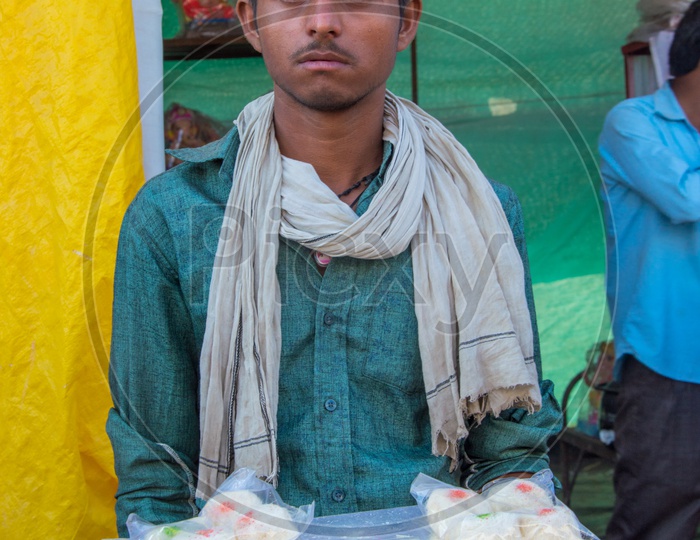 A Vendor Selling Thread Rolls At Shops During Ganesh Festival