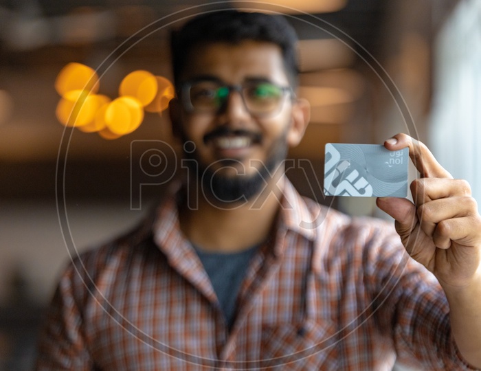 Young Man or Indian Man Holding  Credit Debit Card in Hand Closeup
